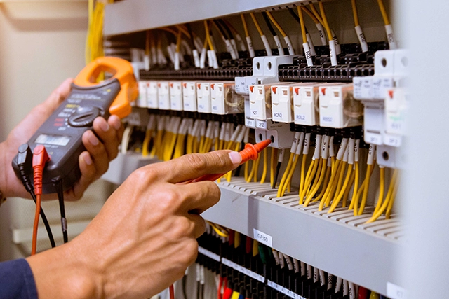 Electrician Testing Electrical Panel Wires for Home Electrical Repair Services